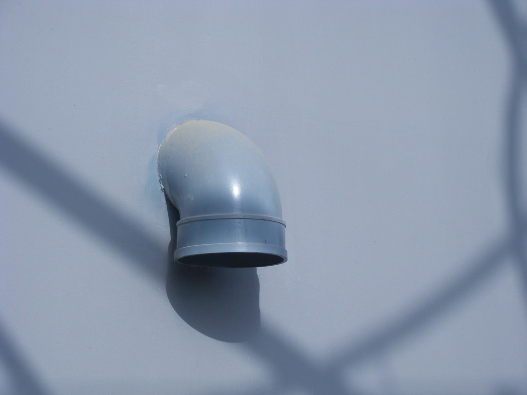 a-security-camera-attached-to-the-side-of-a-building-5pn7oxawzbm